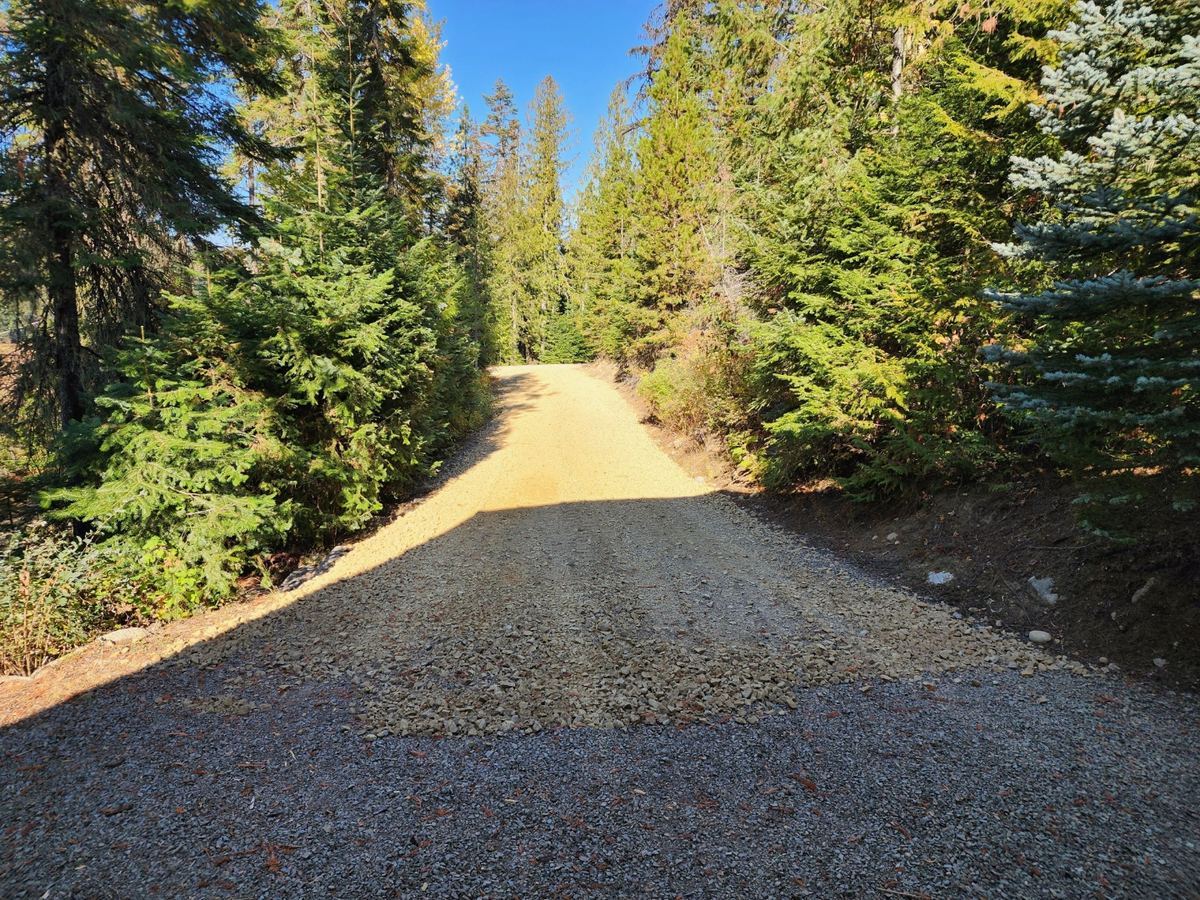Private access road built through timber ground on a Priest River, Idaho property — Premier Land Service road building in Bonner County