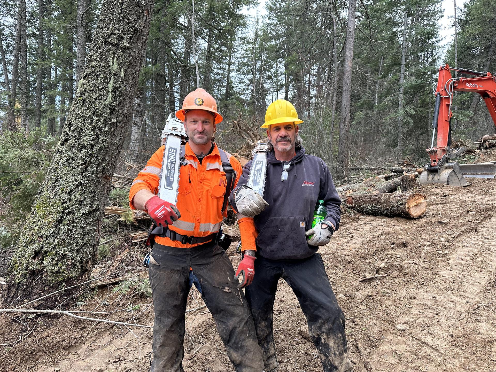 Premier Land Service crew with chainsaws at a forest jobsite
