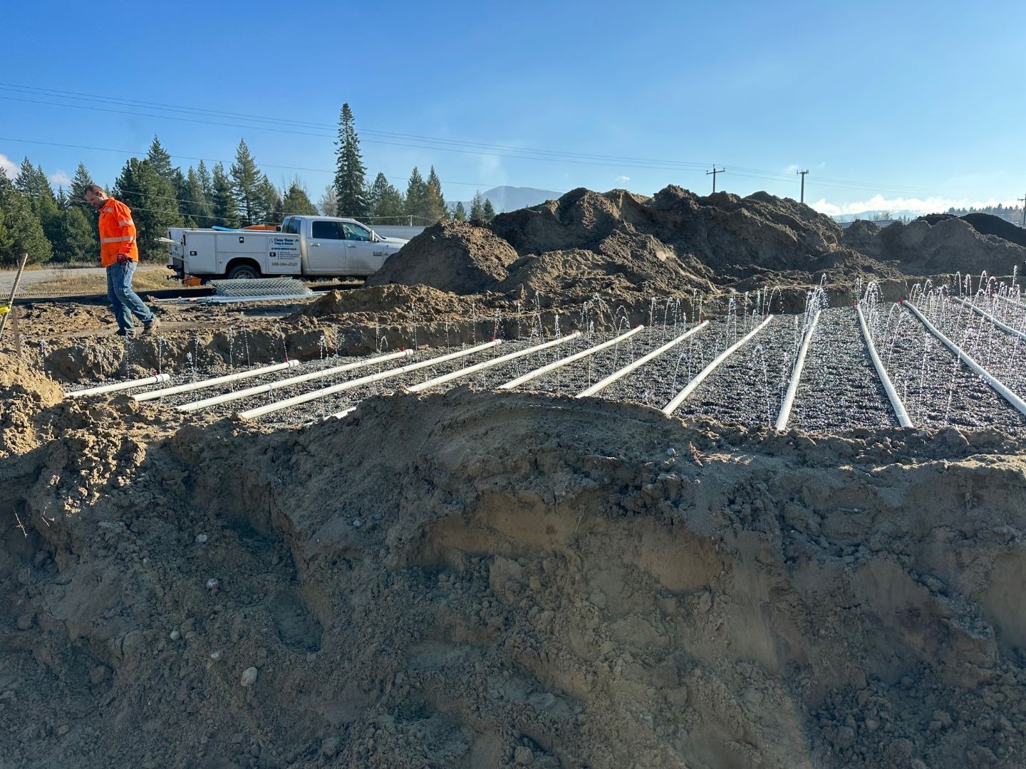 Drainfield installation with distribution pipe on a Bonner County septic system