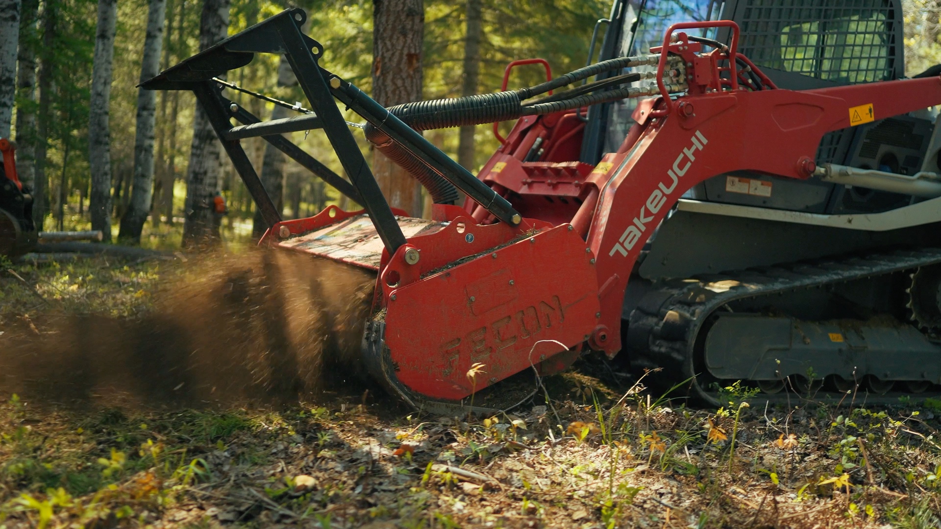 Premier Land Service forestry mulcher actively grinding brush into wood chips on a North Idaho project